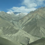 The snowcapped glacier-clad peaks loomed on the distant horizon.