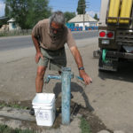 Our “cheater hose” would not fit over this old faucet so it was time to bring out the bucket to top our water up.