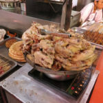 Barbecued pigs’ feet and pig bones were ready to gnaw on.