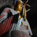 A statue of the Buddha Sakyamuni sits prominently in the center of the first floor of the pagoda, with an ornate lattice above his head (The pagoda is named Sakyamuni Pagoda due to this statue)