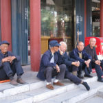 Older men always seem to find the sunny side of the street.