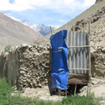 The “outhouse” at Masha’s home was a precarious assembly of old boards and sticks on the side of the hill next to the goat barn.