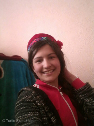 Masha is wearing a traditional Pamiri cap. Men and women seem to wear the same.