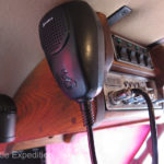 Overhead, a custom walnut console holds a Cobra CB radio, JRV map lights and control switches for fog, driving and four backup lights.