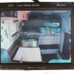 Instead of the non-used rear view mirror, a 5-inch monitor controls our three Total Vision remote cameras; front bumper, rear and one inside the camper. A switch allows us to toggle between the three cameras on the road.