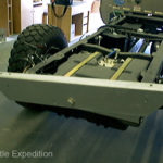 The large pivot bolt in the back isolates the motion of the frame from the camper.