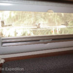 The mosquito screen gets pulled down while the privacy screen is pulled up. A very good idea other window manufacturers should copy!