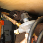 The regulator and the hose for our propane powered Weber Go-Anywhere BBQ connects to our main propane tank on other side with a quick disconnect.