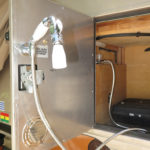 An outside shower is often a great convenience. We throw a sand ladder down for a shower mat.