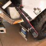 Side compartments go all the way across the back so fishing poles and other long gear will fit.