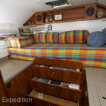 Below the bed are three full-extension drawers. two for clothing and one for stationery.
