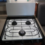 Our three burner Amanda propane stove with a front super burner has withstood the test of time and thousands of meals. Whenever practical we usually cook meat on our Weber Go-Anywhere propane grill outside or over a fire.