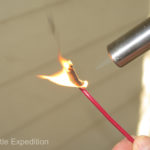 This is a normal automotive wire that easily burns when heated with a torch.