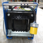 A separate 220V to 110V stepdown converter is used when we are in countries that use only 220 volts AC.