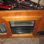On the road, a small Hunter radiator takes hot coolant from the engine to keep the camper warm if we open the valve for that purpose and turn its fan on.