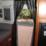 A magnetically closing screen curtain keeps bugs out.